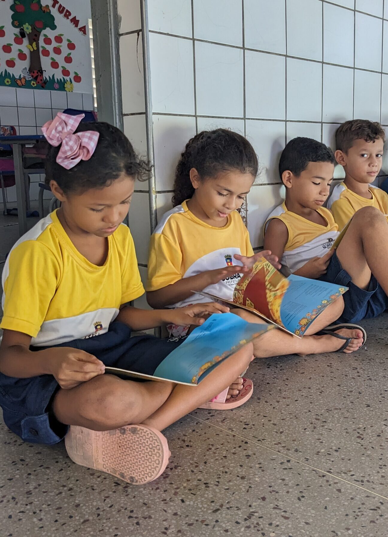 children reading outside