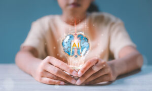 A child holds a lightbulb with the text AI superimposed over the lightbulb.