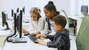 children working on a computer together